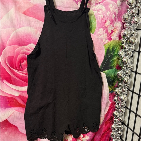 Pants - Sleeveless Romper w/laser cut hem at legs. 
2 pockets in front.